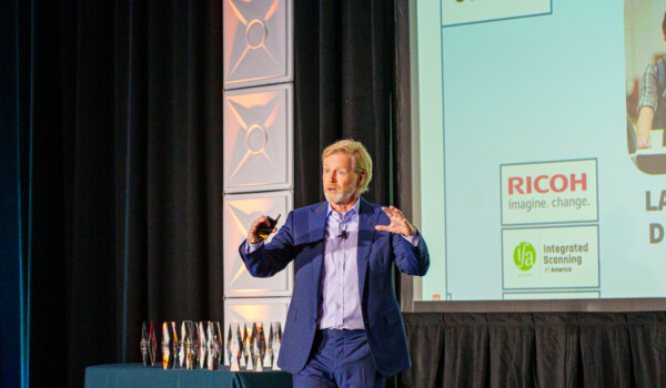 David speaking on stage