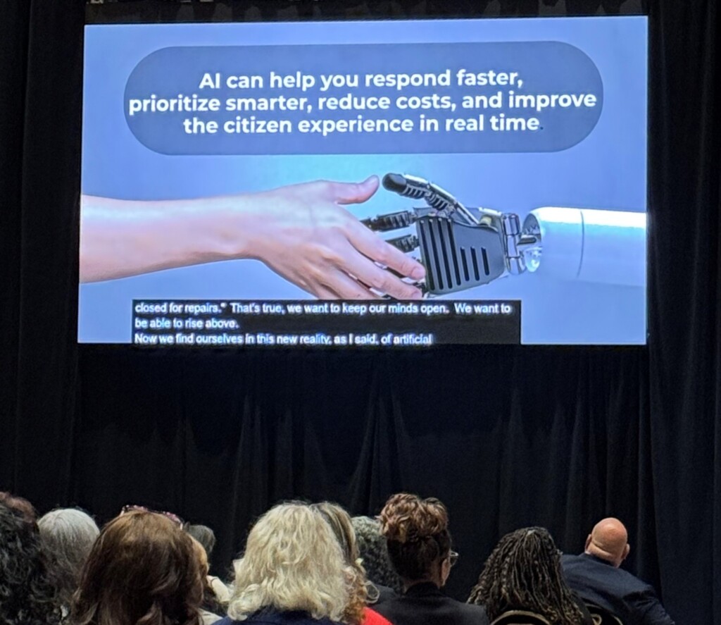 Keynote slide of human hand shaking robot hand