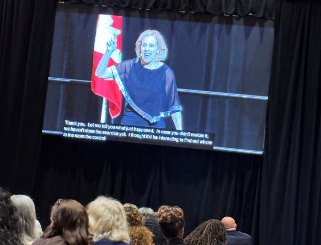Keynote slide of Michelle Ray on stage
