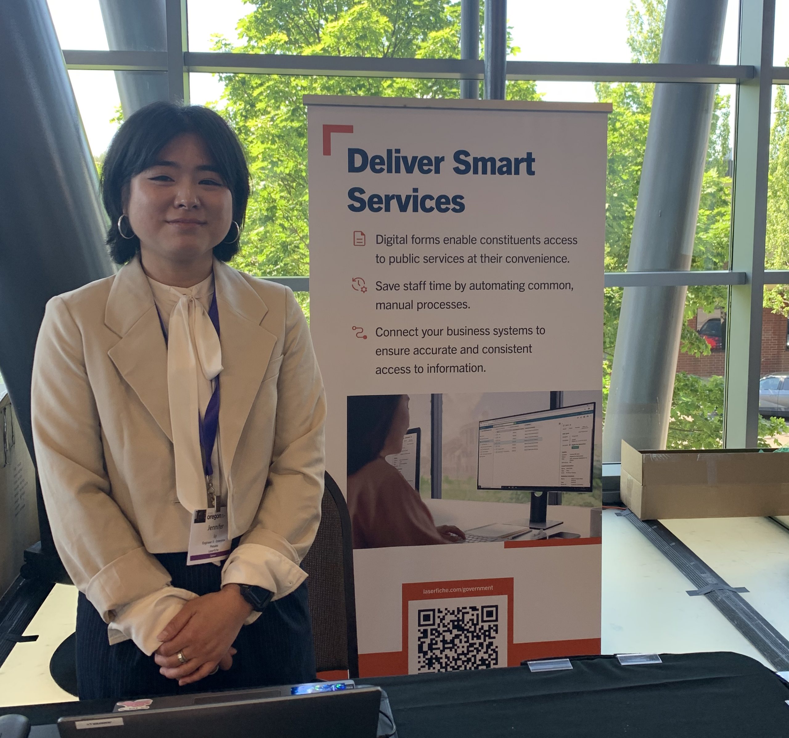 Jennifer next to Laserfiche banner