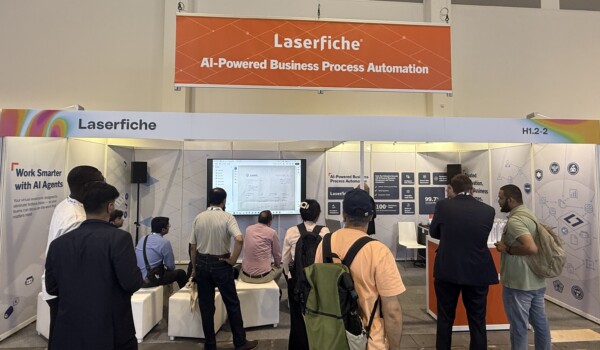 People gathered at Laserfiche booth at GITEX AI Europe 2026