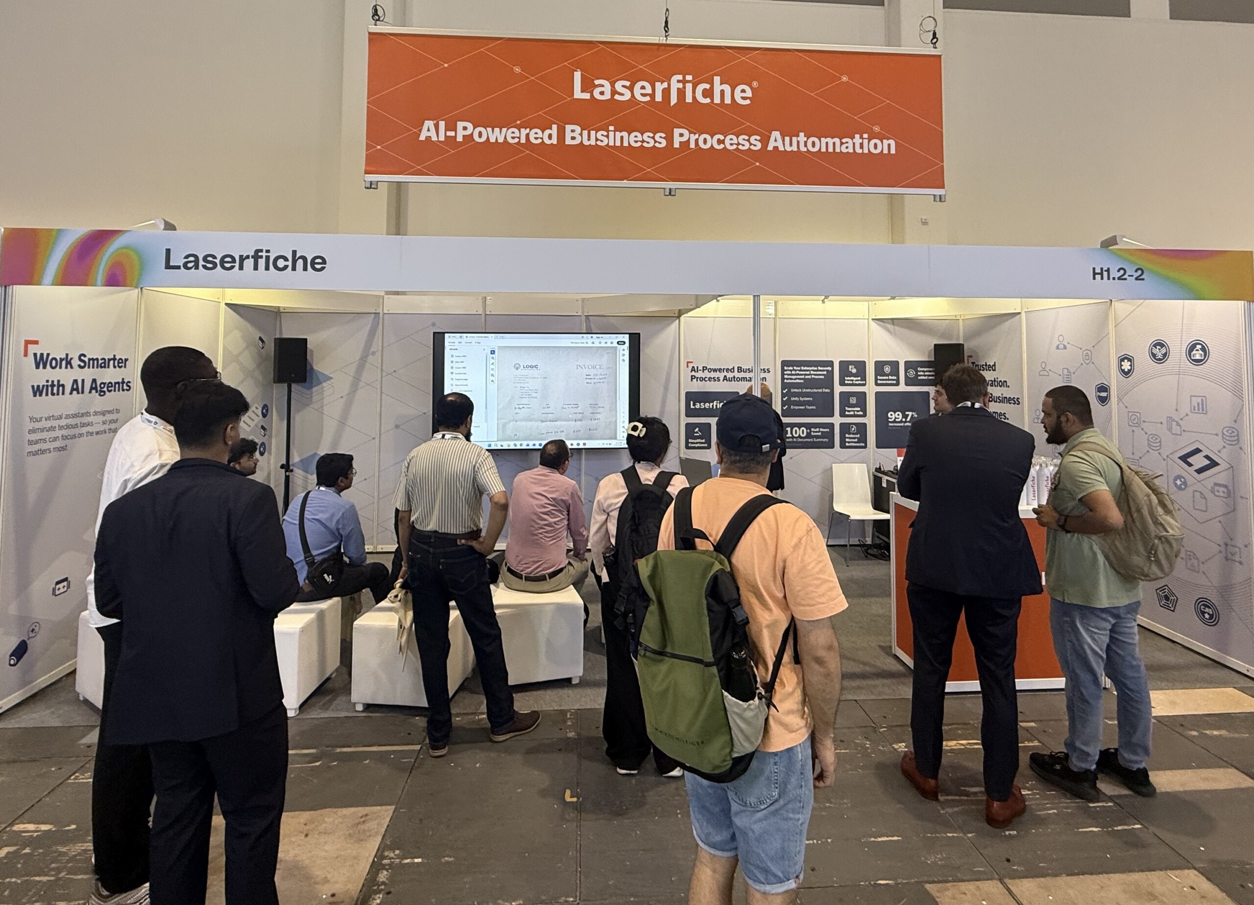 People gathered at Laserfiche booth at GITEX AI Europe 2026