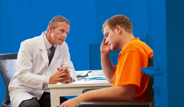 Man speaking with doctor in office