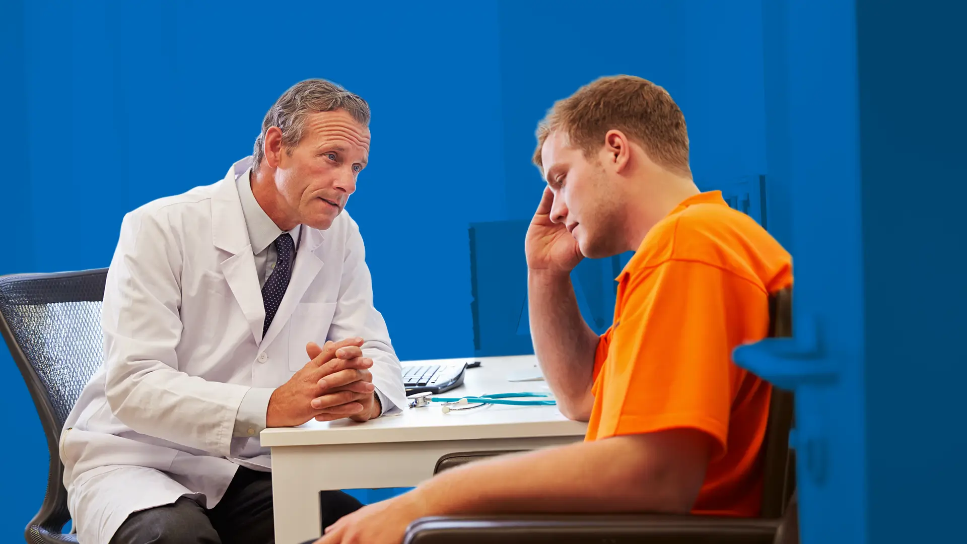 Man speaking with doctor in office